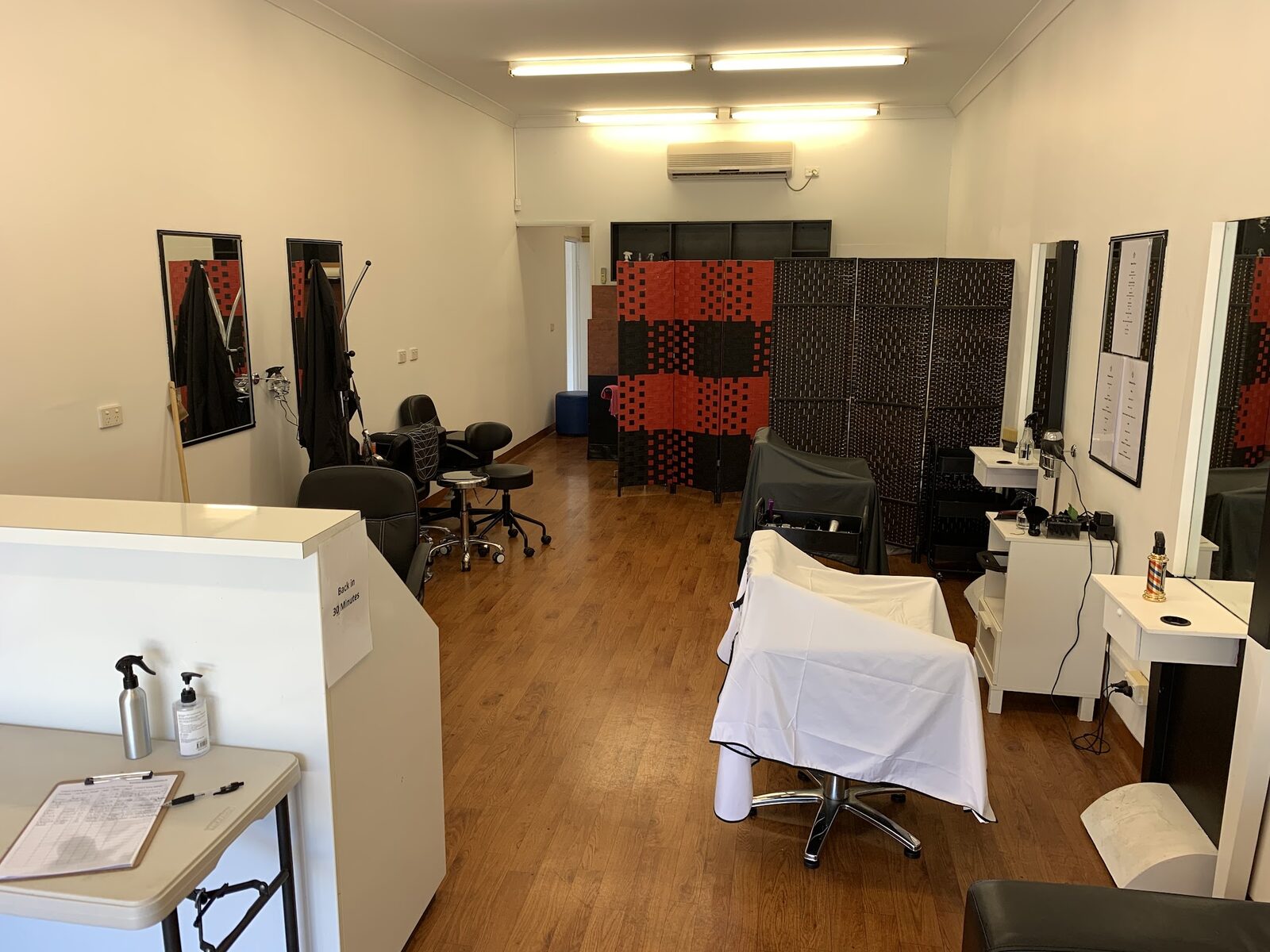 Inside Hair Cuts by Misty: styling chairs, mirrors and timber floors
